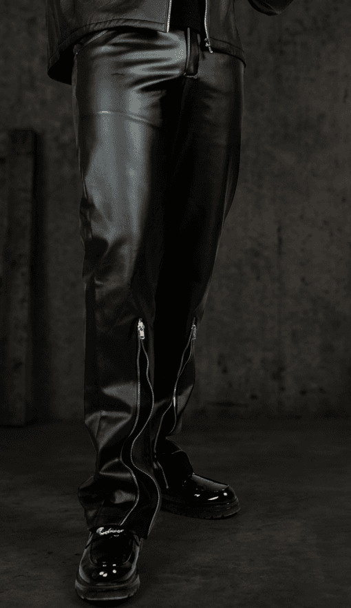 Streetwear accessories including a black tactical bag and red technical straps laid on a metal grate